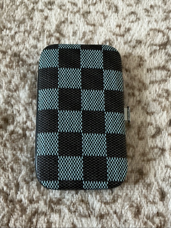 The Unbranded Brand Other - Checker Pattern Case with 8-piece manicure and pedicure grooming kit set.